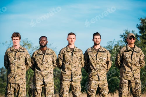 Preview: portrait of multiracial confident soldiers in military uniform standing on range