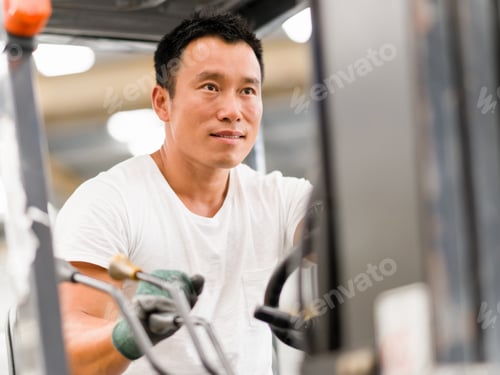 Preview: Asian worker in production plant on the factory floor