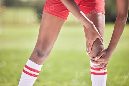 Preview: Medical knee injury, football or sport player in pain with sore or hurt muscle touching leg on a sp