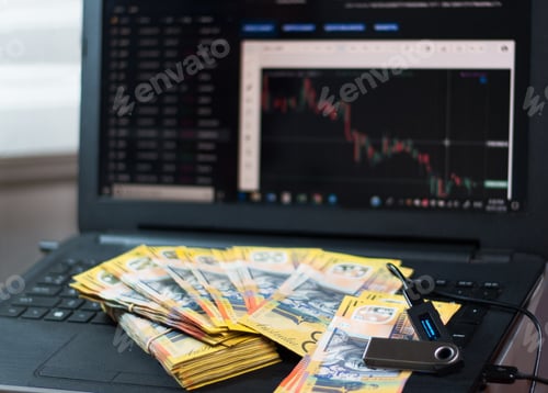 Preview: Australian dollars and nano wallet on the laptop with graphs and charts