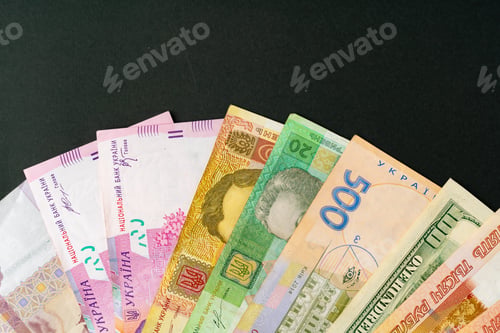 Preview: Pile of money close up, three currency US Dollars, Russian Rubles and Ukrainian Hryvnias
