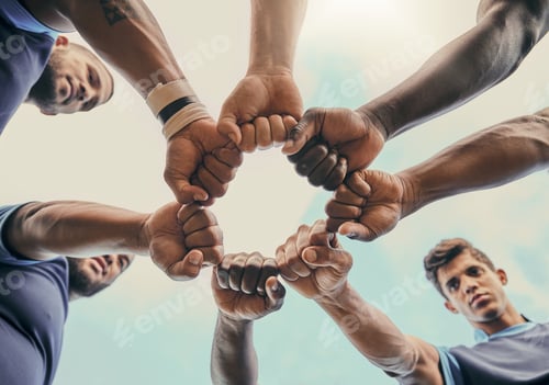 Preview: Hands, fist and solidarity with a sports team standing in a huddle for unity or motivation before a