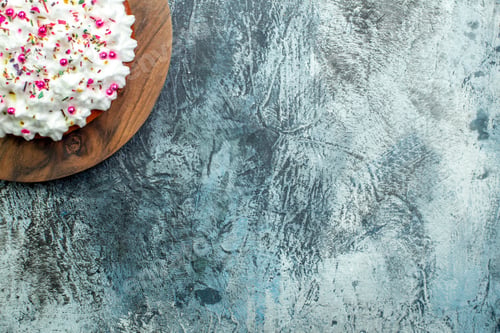 Preview: top half view cake with pastry cream on cutting board on grey table free space