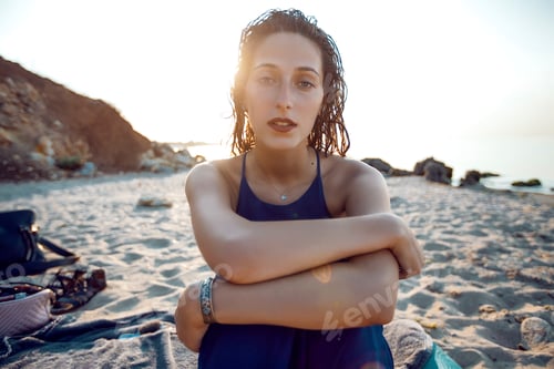 Preview: Portrait of young woman sitting on beach, Odessa, Ukraine