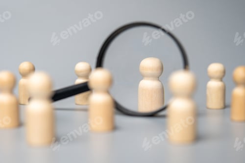 Preview: Wooden dolls and magnifying glass.