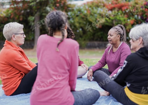 Preview: Multi generational women enjoy day outdoor at city park - Multiracial female friendship