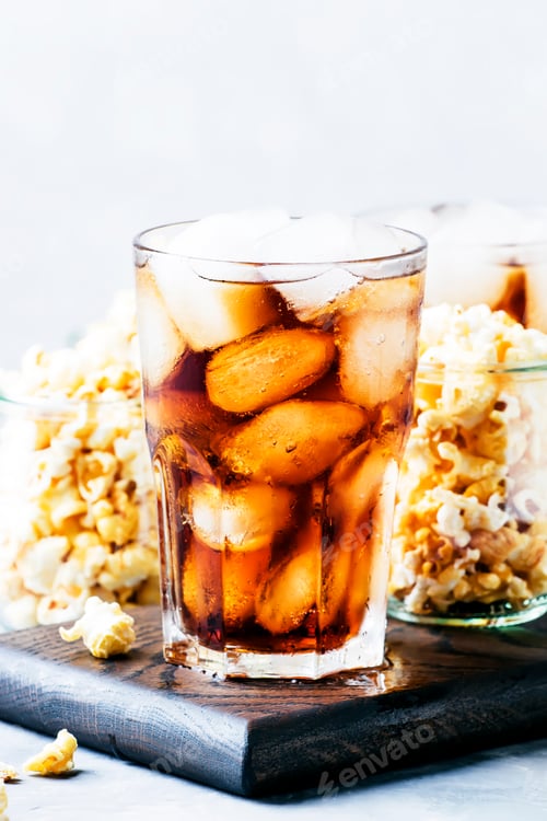 Preview: Cola with ice and sweet popcorn, ready for cinema