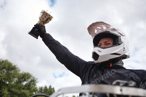 Preview: Raising hand with motorcycle competition cup
