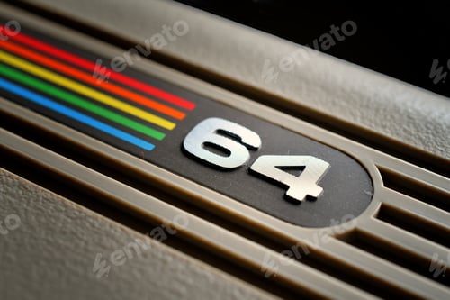 Preview: Close up of the Commodore 64 rainbow logo badge on a vintage computer keyboard