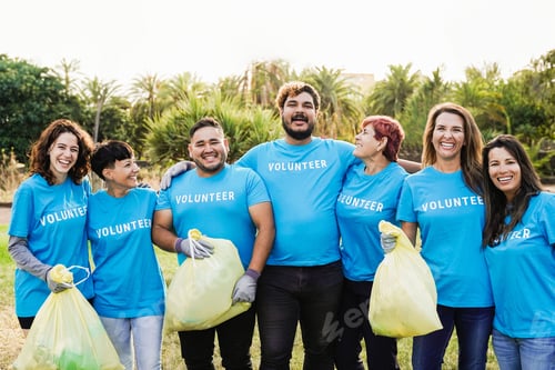 Preview: Happy volunteers helping community clean and recycle plastic at nature park city - Generational