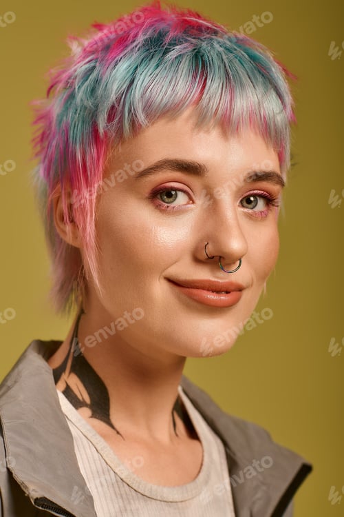 Preview: Young woman embraces unique style with colorful short hair in a studio setting