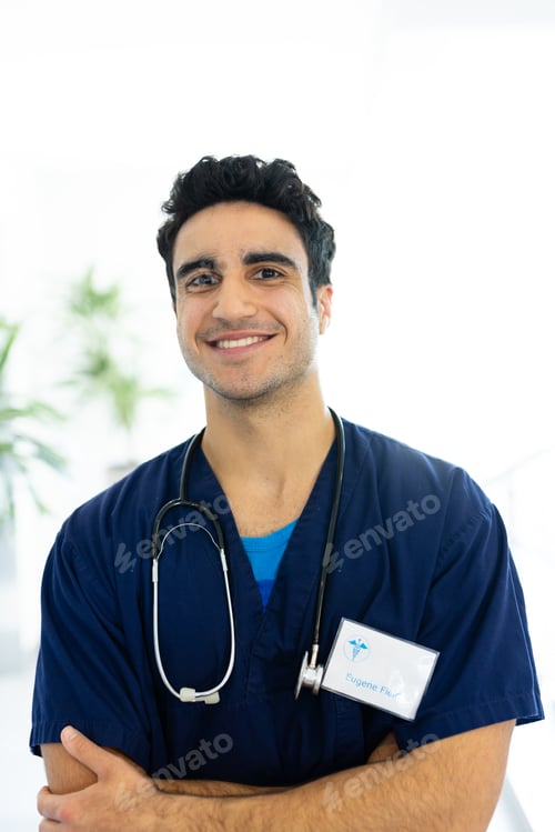 Preview: Vertical portrait of smiling biracial male doctor in hospital corridor, with copy space