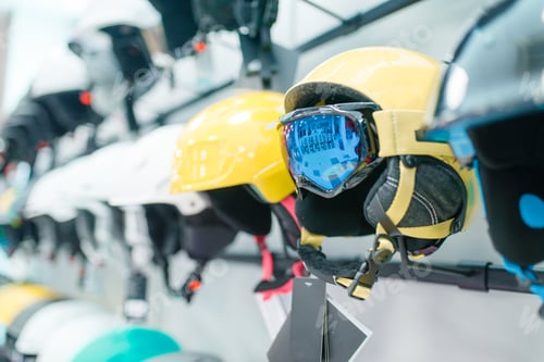 Preview: Rows of ski and snowboarding helmets closeup