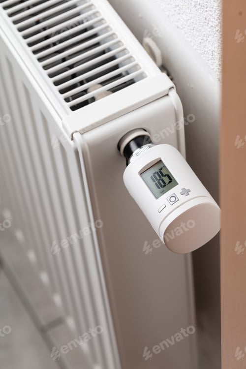 Preview: Woman's hand adjusting temperature.