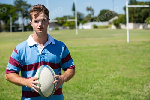Preview: Portrait of rugby player holding ball