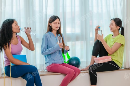 Preview: Diverse Group of Female Friends Resting After Workout