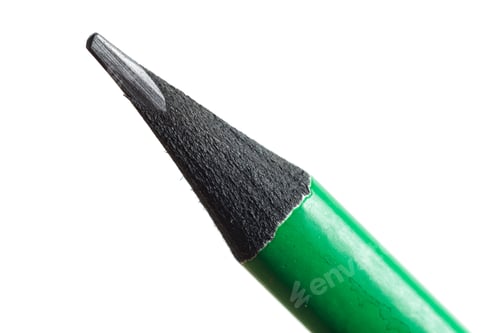 Preview: Using a green pencil to write or draw on a plain white background in natural light