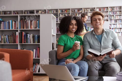 Preview: Group of young people studying in library