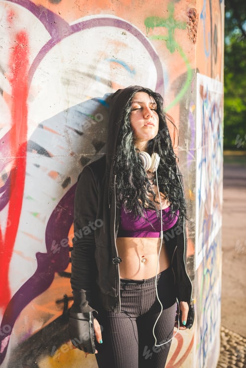Preview: sportive young mixed race curly black hair woman wearing boxer gloves
