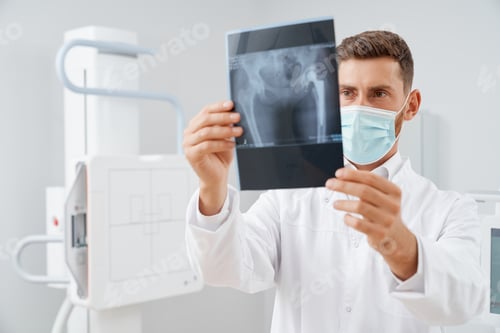 Preview: Doctor with scan result after ultrasound diagnostic of pelvis.