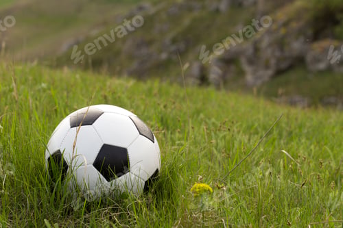Preview: Football and the green hill.