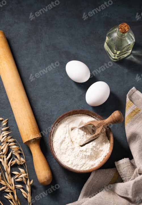 Preview: Organic ingredients for baking, oat flour, oil, eggs, rolling pin and kitchen textiles