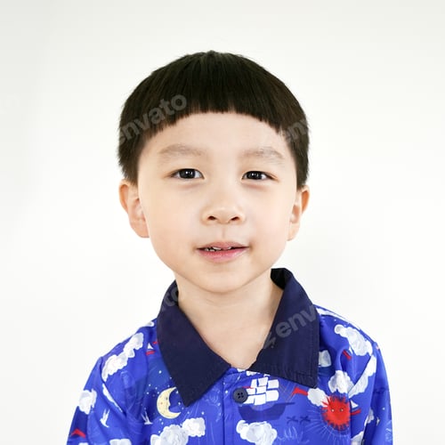 Preview: close-up portrait of child. funny little boy. Portrait Kid boy hair style.