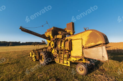 Preview: Closeup shot of harvester machinery on a clear blue sky background