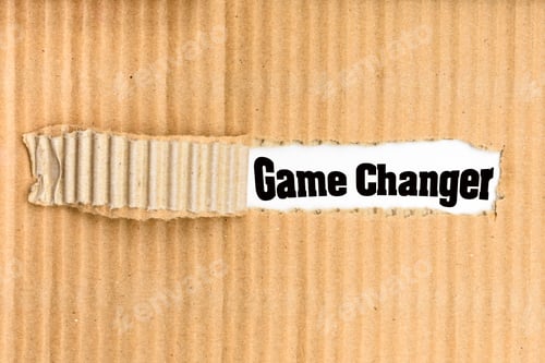 Preview: Game Changer, word written on a torn piece of cardboard.