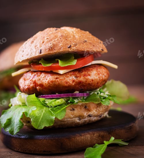 Preview: Big sandwich - hamburger with juicy chicken burger, cheese, tomato, and red onion
