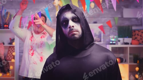 Preview: Zoom in shot of grim reaper at halloween party
