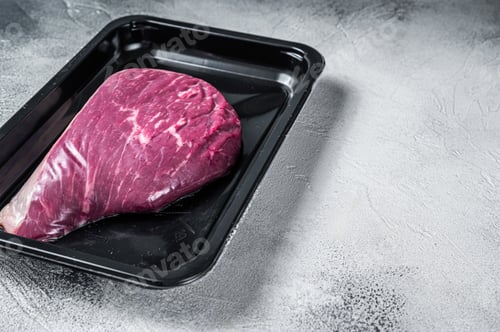 Preview: Raw cap rump steak or top sirloin beef meat steak in vacuum packaging.