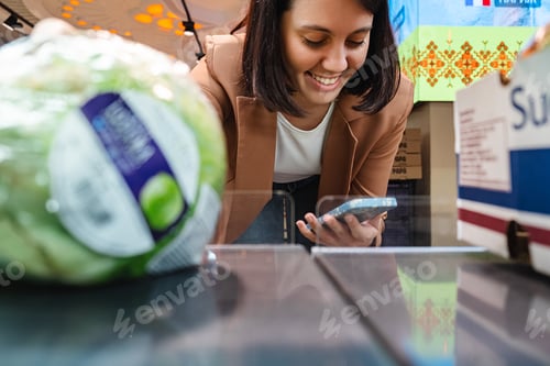Preview: Woman looking for vegetable Taking Products From Shelf Couple Customers Shopping With Checklist