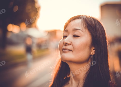 Preview: Woman enjoying sun