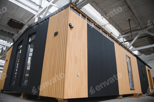 Preview: Prefabricated mobile wooden house at construction site