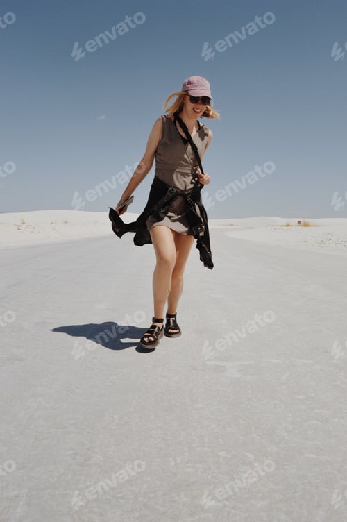 Preview: A smiling girl enjoys a hot summer day in the desert