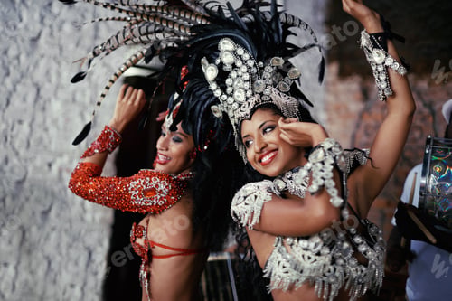 Preview: For the joy of samba. Shot of two beautiful samba dancers performing in a carnival.