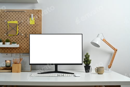 Preview: Creative workspace with blank computer desktop, lamp and stationery