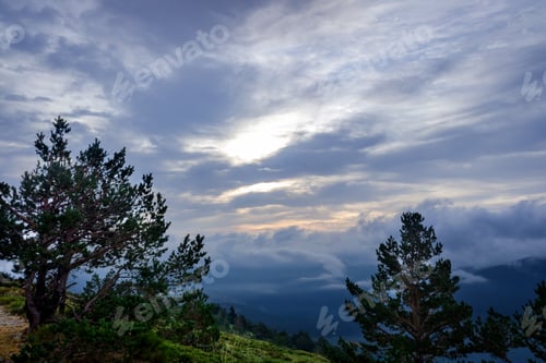 Preview: Nice image as a background of cloudy sky in high mountains for nature background.