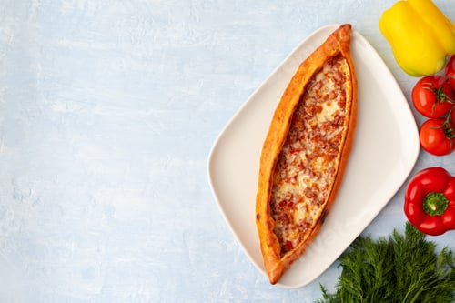 Preview: Turkish baked Pide bread on light blue wooden surface
