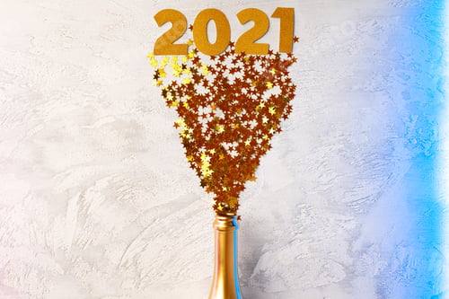 Preview: Champagne bottle with confetti flat lay top view