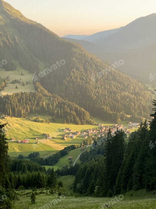 Preview: Alpine valley village with sunset light