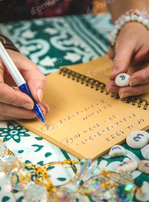 Preview: Numerology numbers on the table. Selective focus.