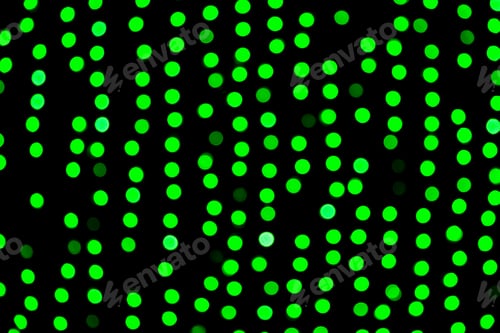 Preview: Unfocused abstract green bokeh on black background. defocused and blurred many round light