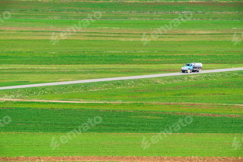 Preview: Road between cultivated agricultural fields