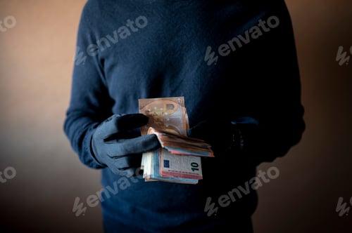 Preview: Closeup of hands with black gloves counting a handful of euro bills