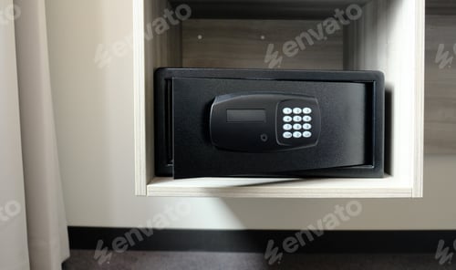 Preview: Metal safe box in the closet. Small narrow safe for keeping money or valuables in the hotel.