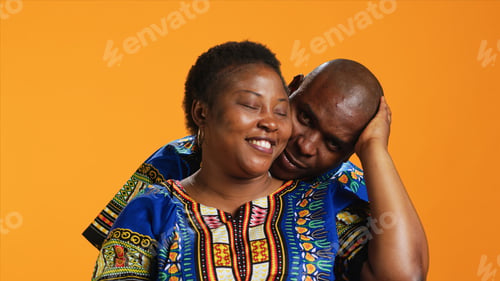 Preview: Caring husband hugging his wife in front of camer