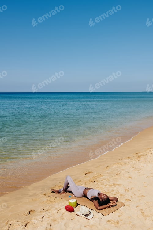 Preview: Yogi sunbathing on beach