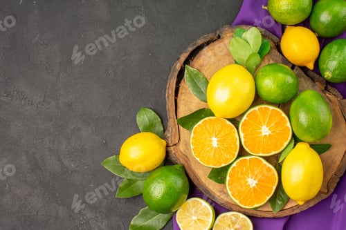 Preview: top view fresh sour lemons on a dark background citrus lime tree fruit